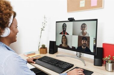 Manager showing how to onboard remote employees during a video call on a laptop